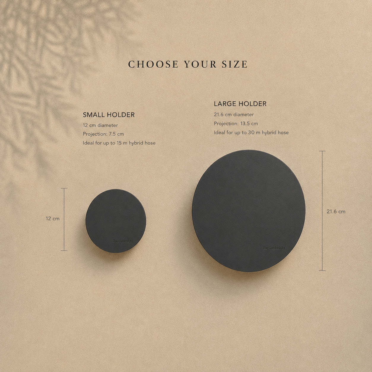 Size comparison of The Gardenista small 12 cm and large 21.6 cm black wall-mounted hose holders.